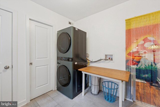 1620 E Berks St, Philadelphia, PA 19125 - laundry area with stacked washing machine and dryer and tile patterned flooring