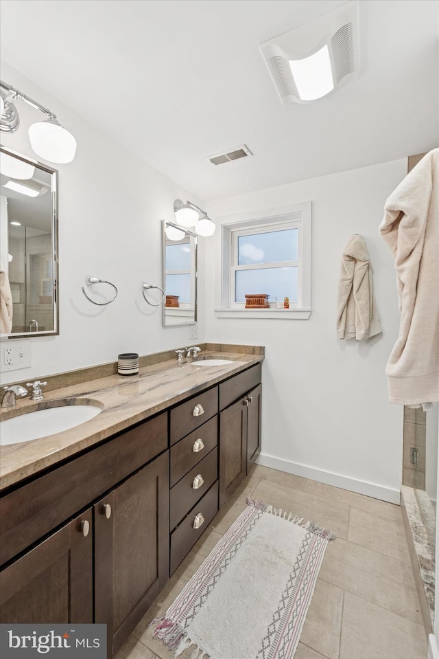 1620 E Berks St, Philadelphia, PA 19125 - bathroom with double vanity, tile patterned flooring, and baseboards