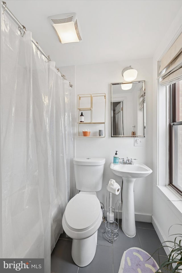 1620 E Berks St, Philadelphia, PA 19125 - bathroom featuring toilet, baseboards, tile patterned floors, and a sink