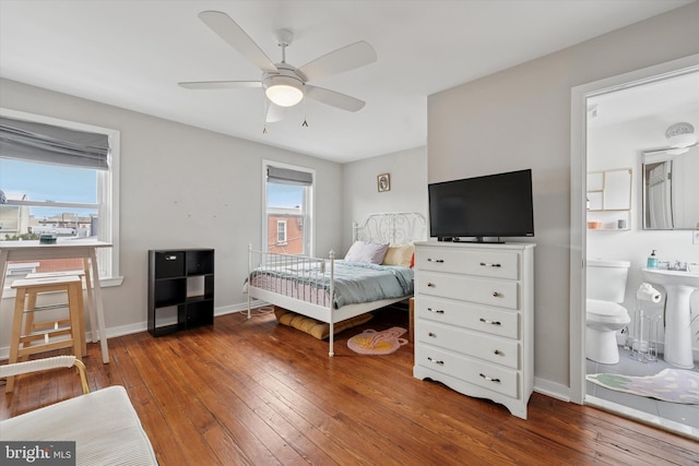 1620 E Berks St, Philadelphia, PA 19125 - bedroom with wood-type flooring, multiple windows, baseboards, and a sink