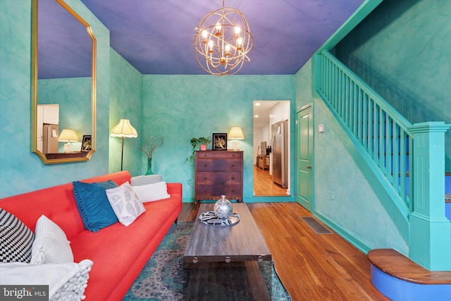 1620 E Berks St, Philadelphia, PA 19125 - living room with wood finished floors, a chandelier, and stairs