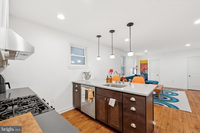 1620 E Berks St, Philadelphia, PA 19125 - kitchen featuring dishwasher, a sink, a peninsula, light wood-style floors, and recessed lighting