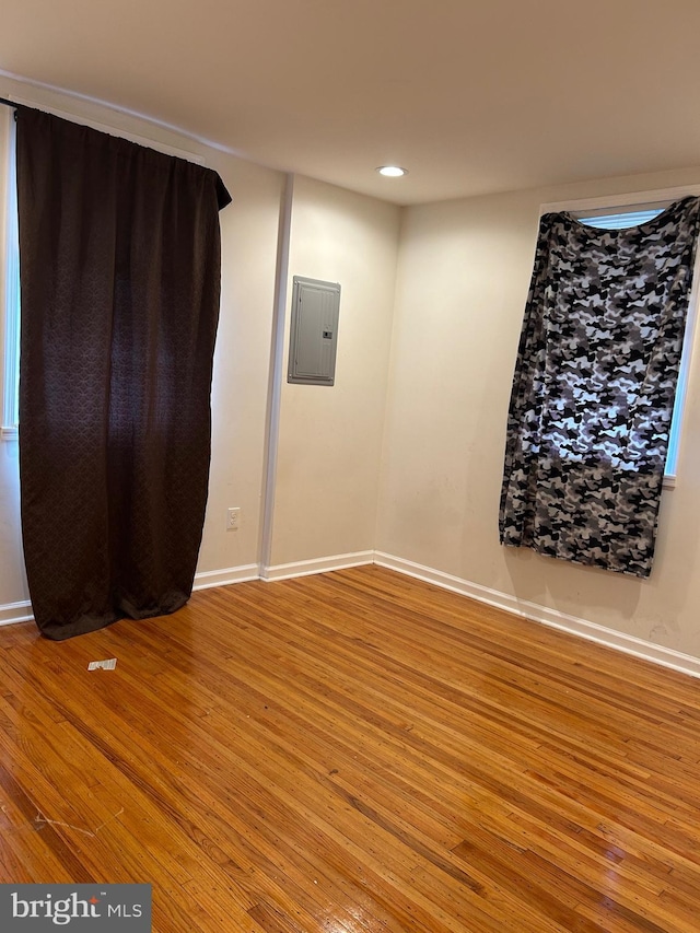 5221 N 8th St, Philadelphia, PA 19120 - empty room with wood finished floors, electric panel, baseboards, and recessed lighting