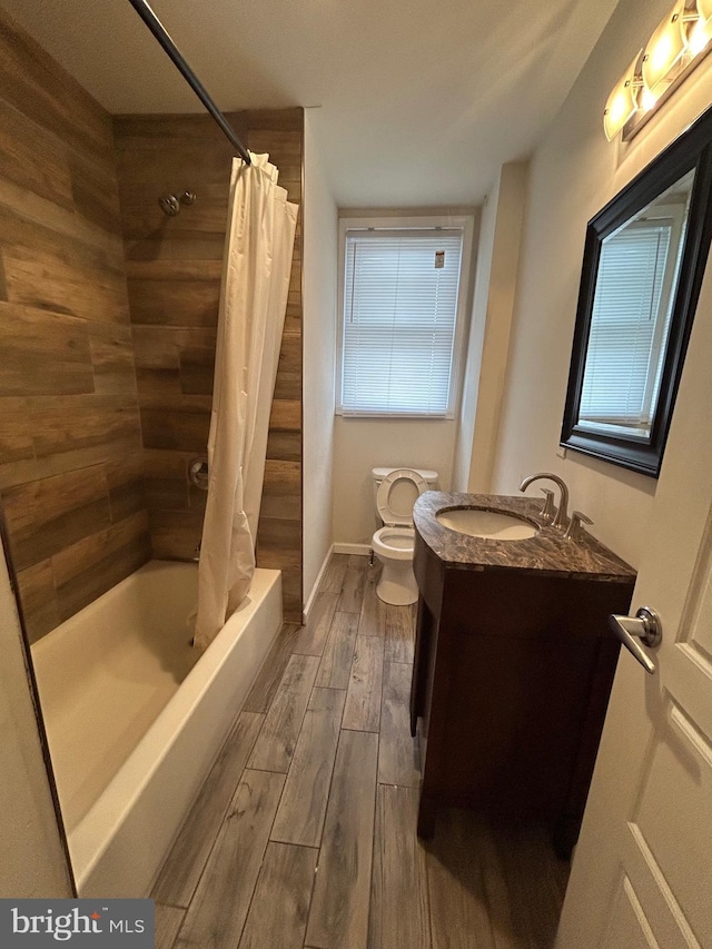 5221 N 8th St, Philadelphia, PA 19120 - full bath featuring toilet, wood finished floors, and vanity