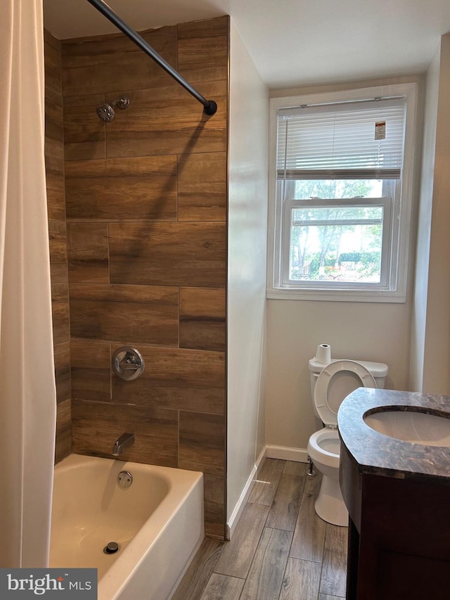 5221 N 8th St, Philadelphia, PA 19120 - full bathroom featuring toilet, shower / bath combination with curtain, wood finished floors, baseboards, and vanity
