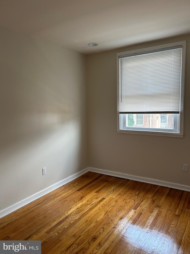 5221 N 8th St, Philadelphia, PA 19120 - empty room featuring wood finished floors and baseboards