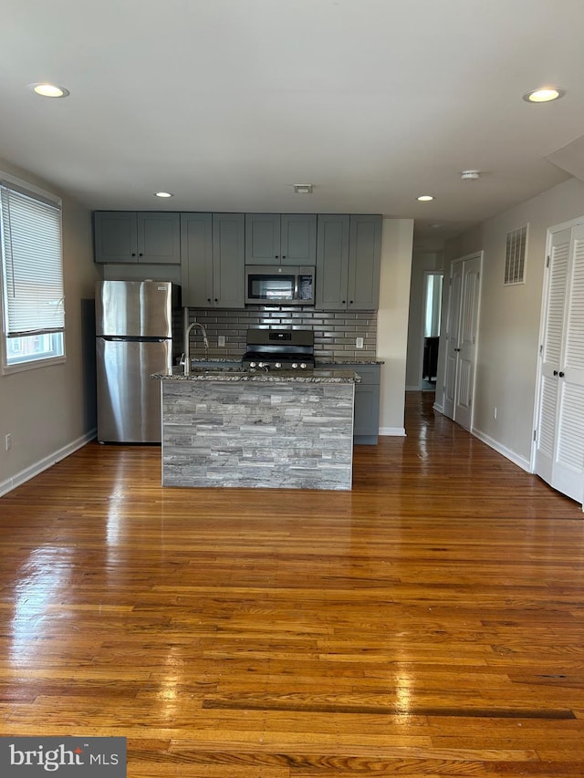 5221 N 8th St, Philadelphia, PA 19120 - kitchen with stainless steel appliances, dark wood-type flooring, baseboards, gray cabinets, and recessed lighting