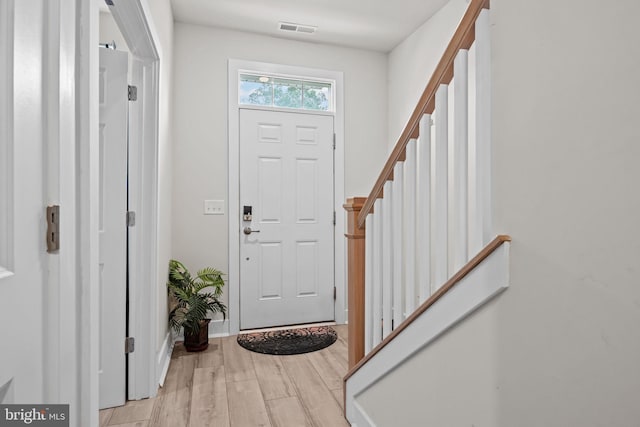 108 Annapolis St, Bensalem, PA 19020 - foyer entrance featuring light wood finished floors, stairs, and baseboards