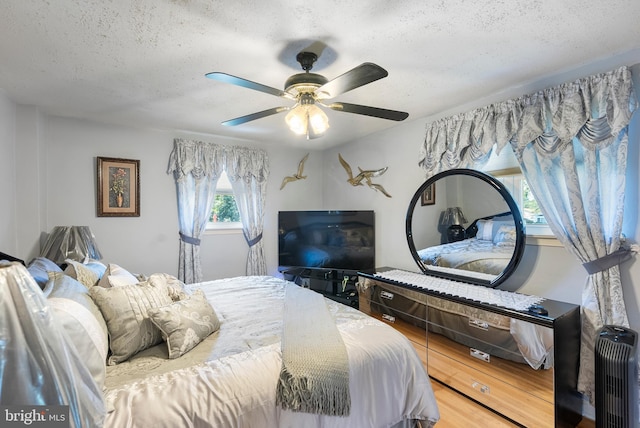 2603 Manall Ave, Pennsauken, NJ 08109 - bedroom featuring wood finished floors, a textured ceiling, and ceiling fan