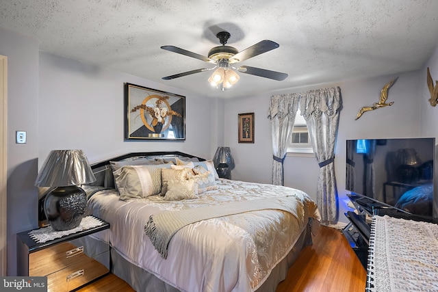 2603 Manall Ave, Pennsauken, NJ 08109 - bedroom featuring a textured ceiling, wood finished floors, and a ceiling fan