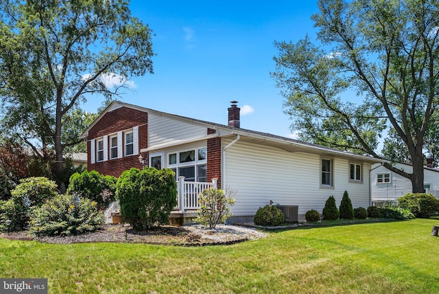 2603 Manall Ave, Pennsauken, NJ 08109 - view of side of home with a lawn and a chimney