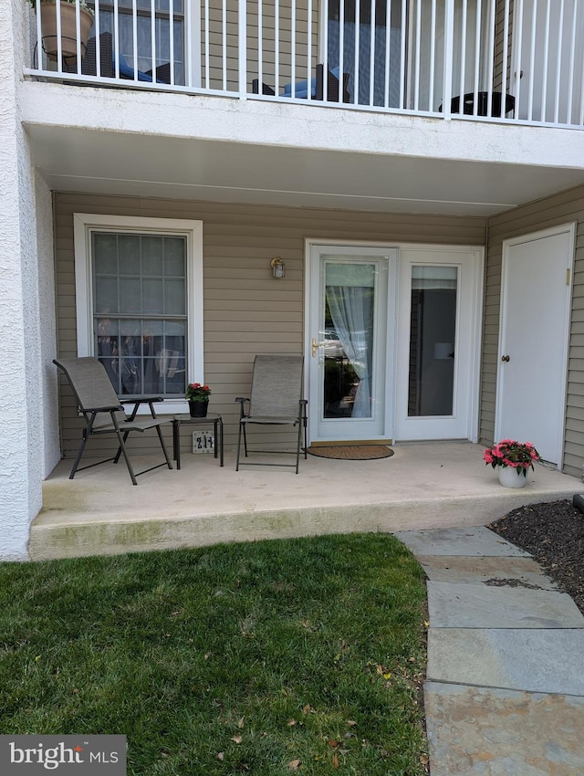 211 Brandon Unit 211, Jeffersonville, PA 19403 - view of exterior entry with a balcony and a patio