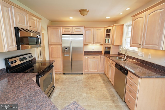 5991 Bell Creek Dr, Salisbury, MD 21801 - kitchen featuring stainless steel appliances, light brown cabinets, a sink, glass insert cabinets, and dark stone counters