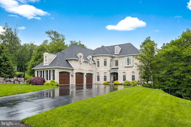 1780 Eliza Way, Mechanicsburg, PA 17050 - french country style house with stone siding, asphalt driveway, a front yard, and a garage