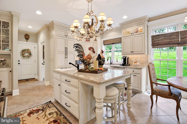 1780 Eliza Way, Mechanicsburg, PA 17050 - kitchen with a kitchen island, light stone countertops, ornamental molding, a chandelier, and a sink
