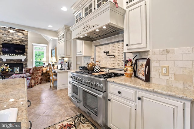 1780 Eliza Way, Mechanicsburg, PA 17050 - kitchen with double oven range, premium range hood, open floor plan, ceiling fan, and a stone fireplace