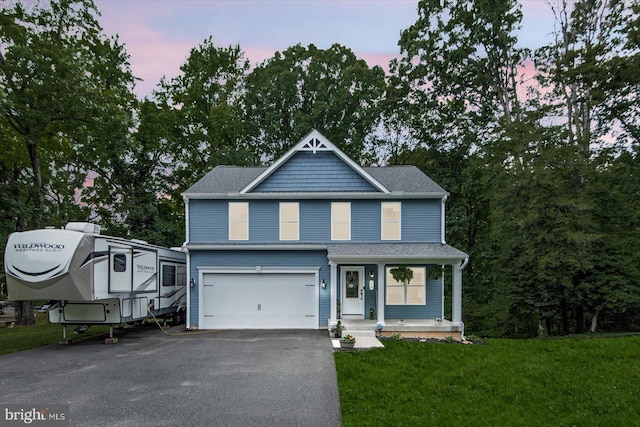 308 Walnut Dr, Fredericksburg, VA 22405 - view of front of house featuring asphalt driveway, an attached garage, a yard, a porch, and a shingled roof