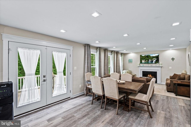 308 Walnut Dr, Fredericksburg, VA 22405 - dining room featuring french doors, wood finished floors, a warm lit fireplace, baseboards, and recessed lighting