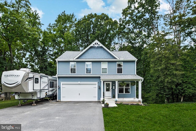 308 Walnut Dr, Fredericksburg, VA 22405 - view of front of property with driveway, an attached garage, covered porch, a front yard, and a shingled roof