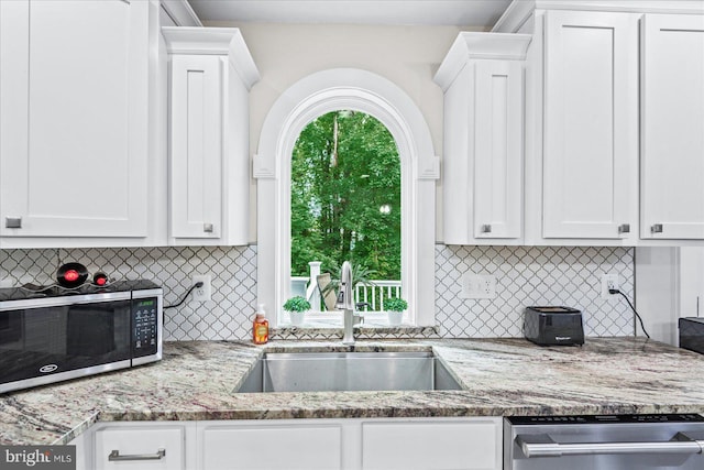 308 Walnut Dr, Fredericksburg, VA 22405 - kitchen with stainless steel appliances, a sink, and white cabinetry