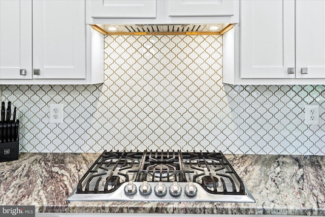 308 Walnut Dr, Fredericksburg, VA 22405 - kitchen with stainless steel gas cooktop, backsplash, white cabinetry, and ventilation hood