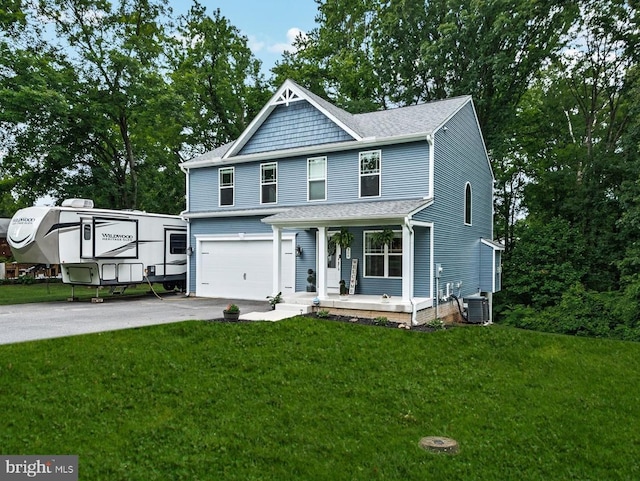 308 Walnut Dr, Fredericksburg, VA 22405 - view of front of house featuring covered porch, central AC, an attached garage, driveway, and a front yard