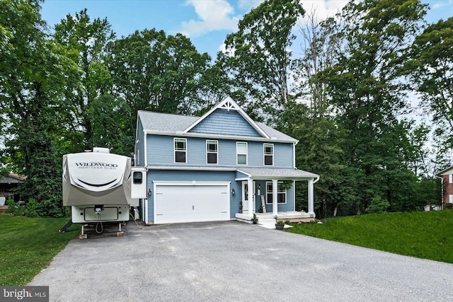 308 Walnut Dr, Fredericksburg, VA 22405 - view of front of property featuring driveway, a porch, an attached garage, and a front yard