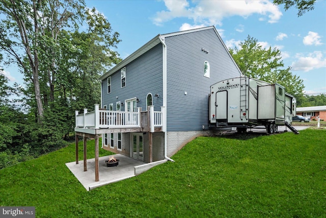 308 Walnut Dr, Fredericksburg, VA 22405 - back of property with a lawn, a fire pit, and a patio area