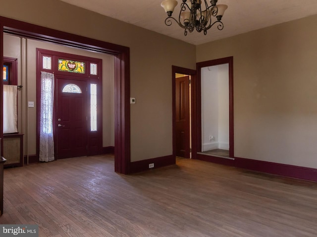 21 E 3rd St, Boyertown, PA 19512 - foyer entrance with wood finished floors, a chandelier, and baseboards