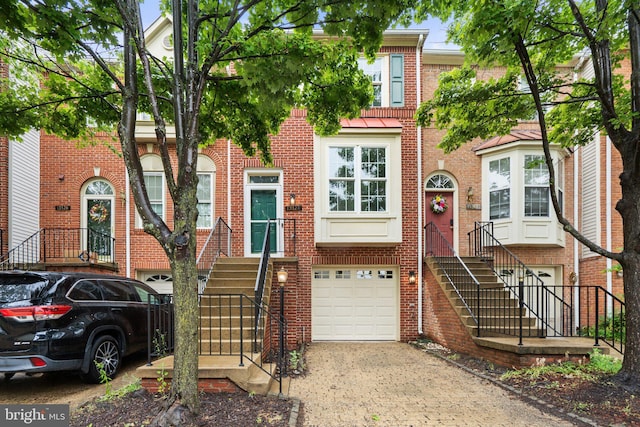13124 Kidwell Field Rd, Herndon, VA 20171 - multi unit property featuring driveway, a garage, and brick siding