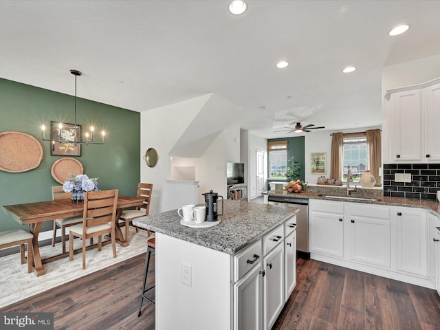 117 Holstein Dr Unit 164, Hanover, PA 17331 - kitchen with a sink, stainless steel dishwasher, white cabinets, a center island, and dark wood-style flooring