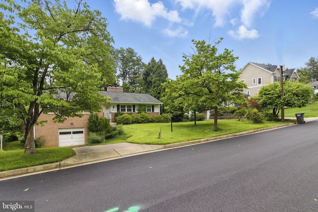 6178 Hardy Dr, Mclean, VA 22101 - view of front of property with concrete driveway, a front yard, a garage, and a chimney