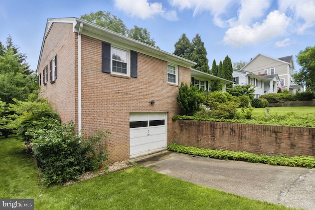6178 Hardy Dr, Mclean, VA 22101 - view of side of home with a garage, brick siding, driveway, and a yard