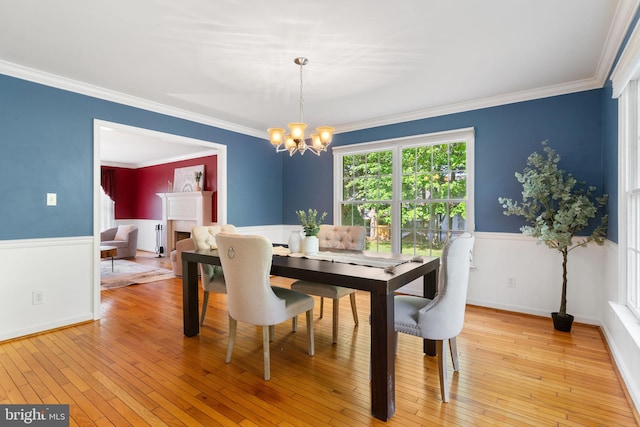 140 Hoile Ln, Huntingtown, MD 20639 - dining space with a chandelier, light wood-type flooring, and ornamental molding
