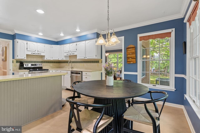 140 Hoile Ln, Huntingtown, MD 20639 - kitchen featuring stainless steel appliances, light countertops, tasteful backsplash, a chandelier, and white cabinetry