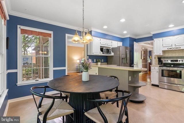 140 Hoile Ln, Huntingtown, MD 20639 - kitchen with appliances with stainless steel finishes, white cabinetry, a peninsula, a chandelier, and tasteful backsplash