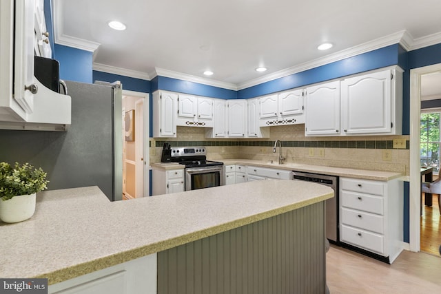 140 Hoile Ln, Huntingtown, MD 20639 - kitchen featuring appliances with stainless steel finishes, a peninsula, light countertops, backsplash, and ornamental molding