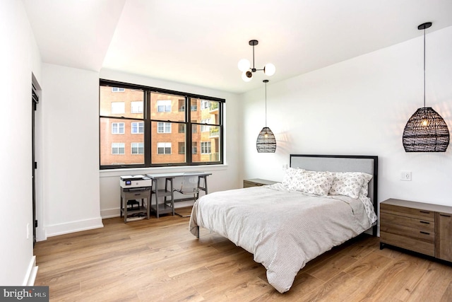 3801 Canterbury Rd Unit 705, Baltimore, MD 21218 - bedroom with wood finished floors and baseboards
