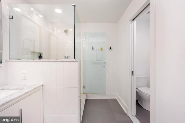 3801 Canterbury Rd Unit 705, Baltimore, MD 21218 - full bathroom with toilet, a shower stall, vanity, tile patterned floors, and baseboards