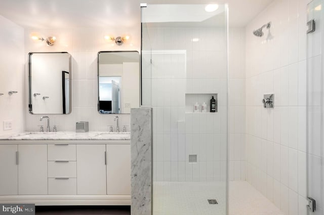 3801 Canterbury Rd Unit 705, Baltimore, MD 21218 - full bathroom featuring a tile shower and double vanity