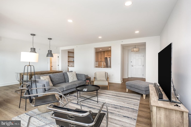 3801 Canterbury Rd Unit 705, Baltimore, MD 21218 - living room featuring wood finished floors, recessed lighting, and baseboards