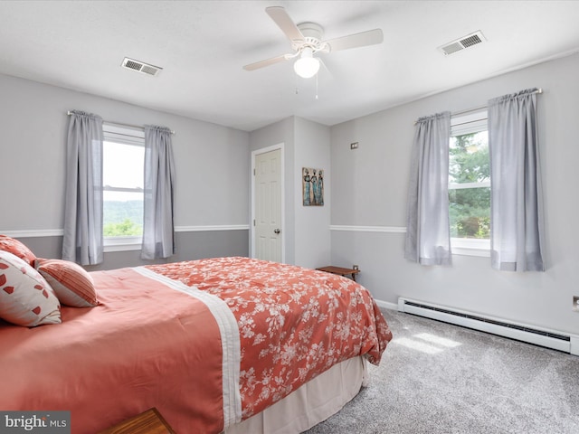180 Oak Heights Rd, Front Royal, VA 22630 - bedroom with a baseboard heating unit, multiple windows, carpet flooring, and ceiling fan