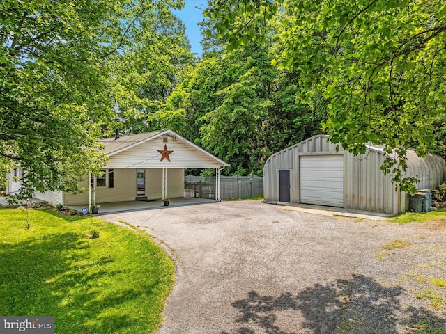 180 Oak Heights Rd, Front Royal, VA 22630 - view of front of house with driveway, an outbuilding, a garage, and a carport