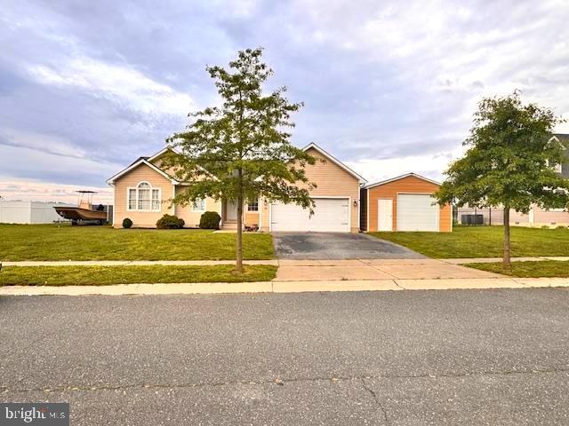 15 Ridgeway Dr, Ridgely, MD 21660 - view of front of home featuring a front yard, asphalt driveway, and an attached garage