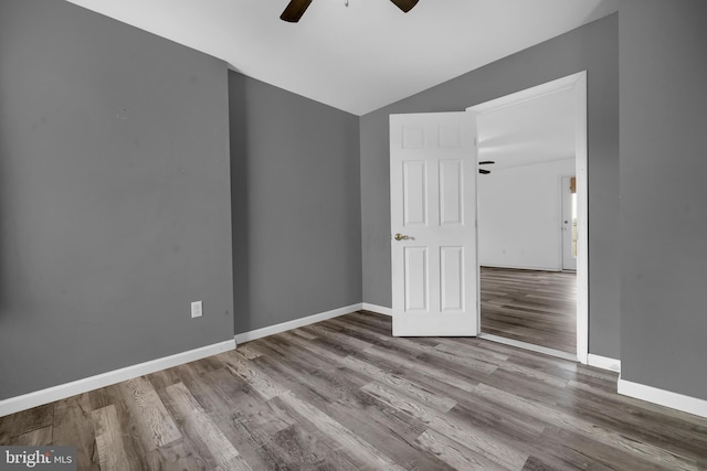 15 Ridgeway Dr, Ridgely, MD 21660 - empty room with a ceiling fan, wood finished floors, and vaulted ceiling