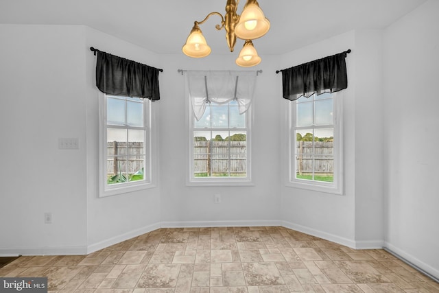 15 Ridgeway Dr, Ridgely, MD 21660 - empty room with a chandelier and stone finish floors