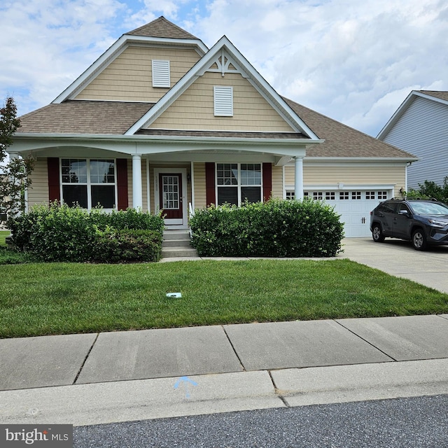 16288 Corkscrew Ct Unit 203, Lewes, DE 19958 - view of front of house featuring an attached garage, a front yard, concrete driveway, a porch, and roof with shingles