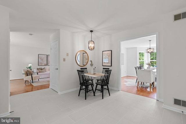 9109 Knox Ct, Laurel, MD 20723 - dining room with a chandelier and baseboards