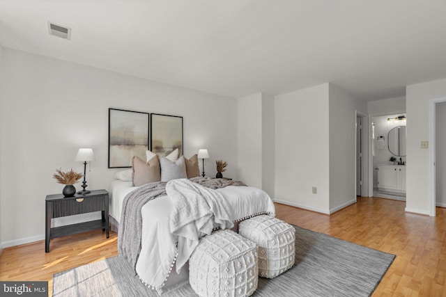 9109 Knox Ct, Laurel, MD 20723 - bedroom with light wood finished floors and baseboards