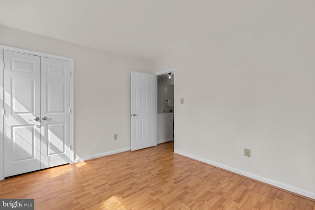 9109 Knox Ct, Laurel, MD 20723 - unfurnished bedroom featuring wood finished floors, baseboards, and a closet